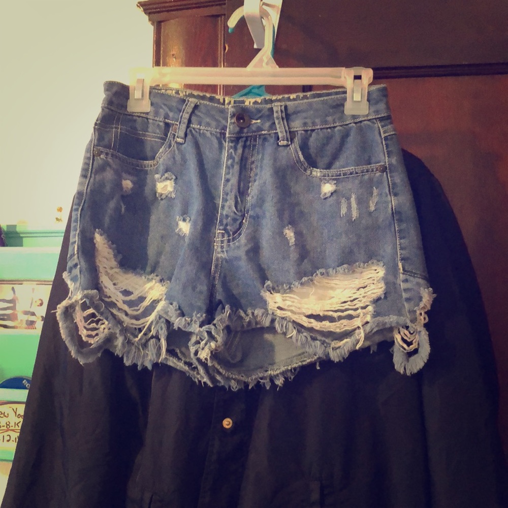 Distressed denim shorts.